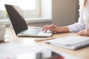 Person typing on a laptop